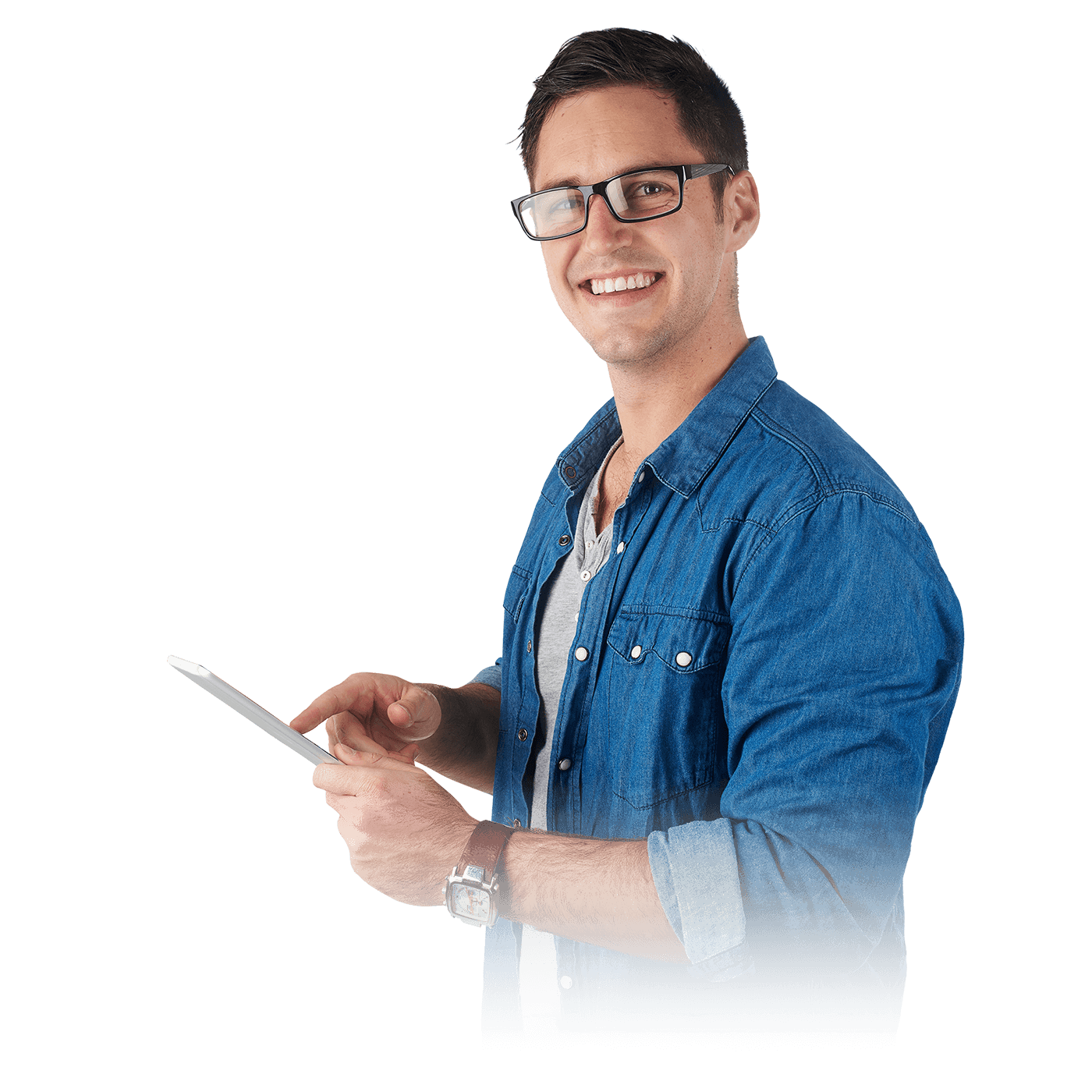 A man with spectacles in a blue overshirt smiling and using a mobile phone.
