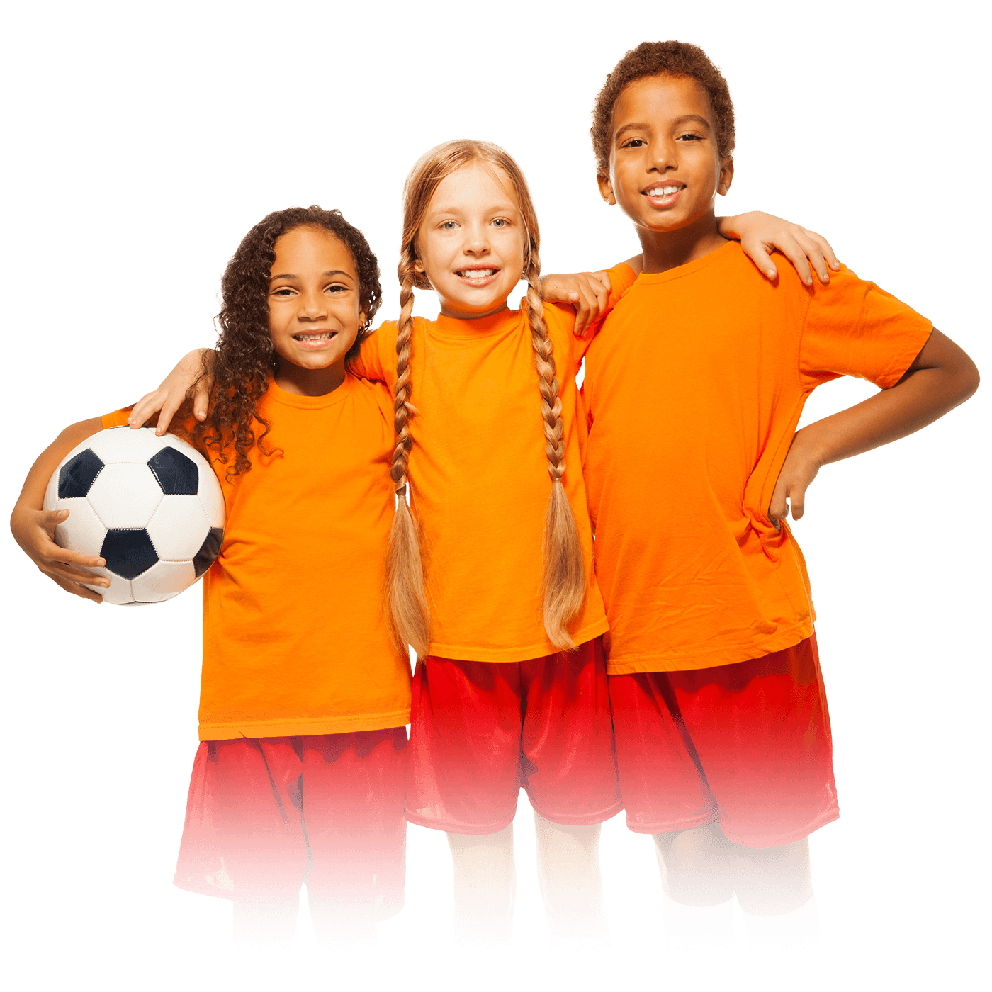 Three children in orange jerseys and red shorts posing together with a soccer ball.