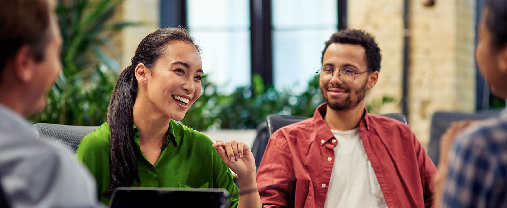 People seated and discussing a project.